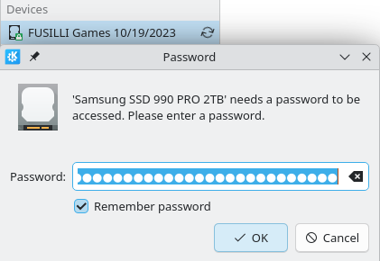 A screenshot showing a Bitlocker-encrypted device labeled “FUSILLI Games 10/19/2023”. Below this, a different dialog box showing that a password needs to be entered to access this device.